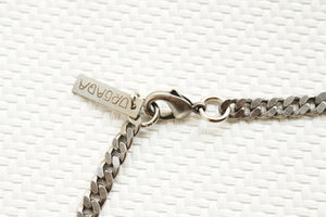 ORGADA'S Hieroglyph Queen necklace and a lobster clasp closure in close-up