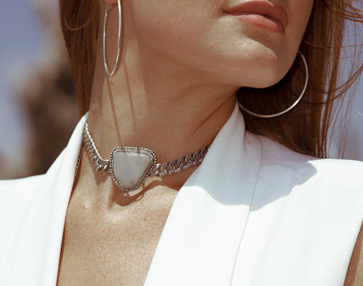 a model is modelling Orgada's Moonstone Pariteet Choker designed for the ultimate bohemian princess at the beach