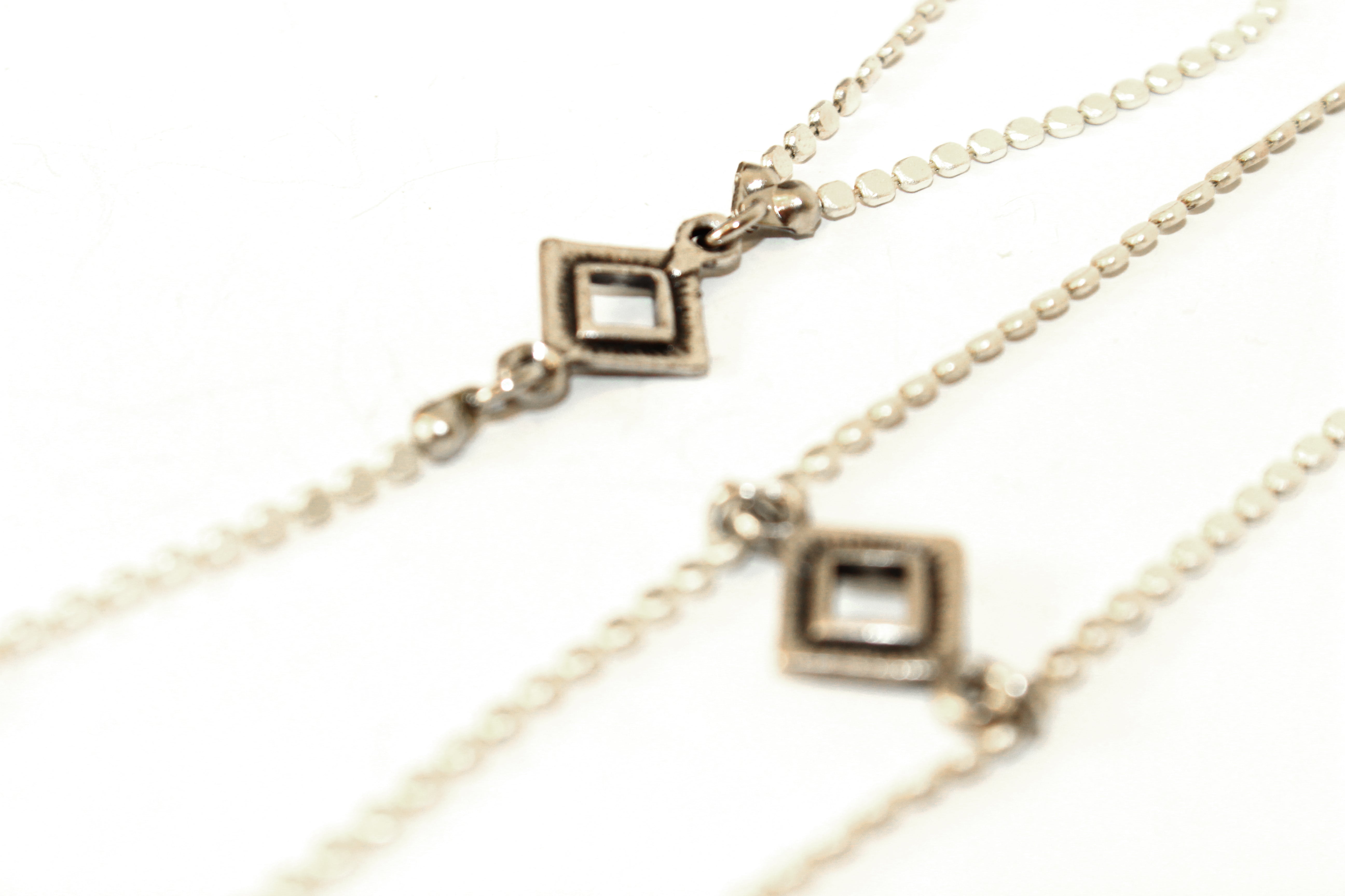 Orgada's bohemian breezy Cleopatra Ring Bracelet and a matching necklace on a white background in close up