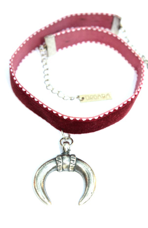 Orgada's Maroon Gypsy Luna Choker made with a soft velvet strap and a moon pendant on a white background
